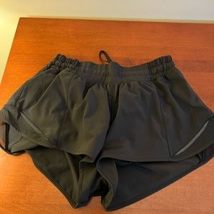 Three Lululemon shorts and one skirt all size 8.